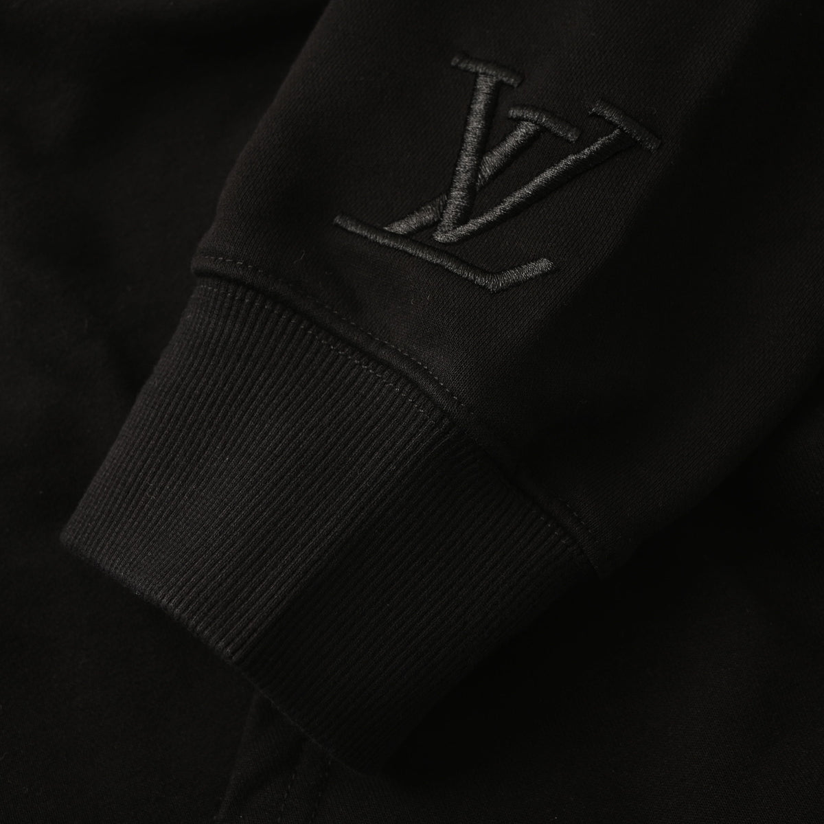 Louis Vuitton Black Tonal Monogram Pullover Hoodie with Wave Chest Panel, Embroidered Logo Detailing and Ribbed Trim for Minimalist Streetwear