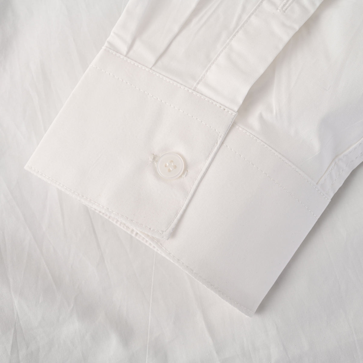 Louis Vuitton White Long-Sleeve Button-Up Shirt with Black Letter Embroidery, Drop-Shoulder Silhouette, Shell Buttons and Curved High-Low Hem